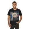 Smiling man wearing black celestial graphic tee with cosmic and star design, white background
